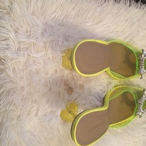 Transparent neon green heels.